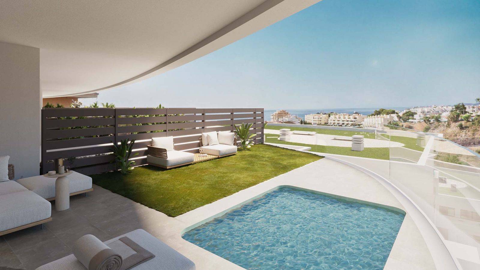 Privézwembad en terras bij Korall Residences met uitzicht op zee.